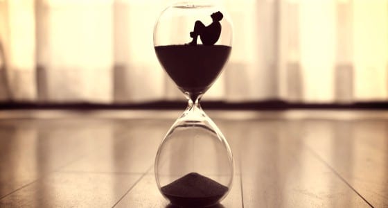 man inside hourglass